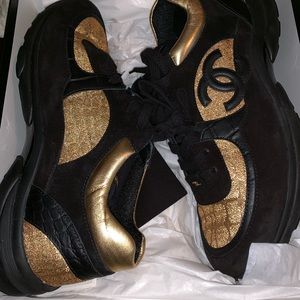 black and gold chanel trainers